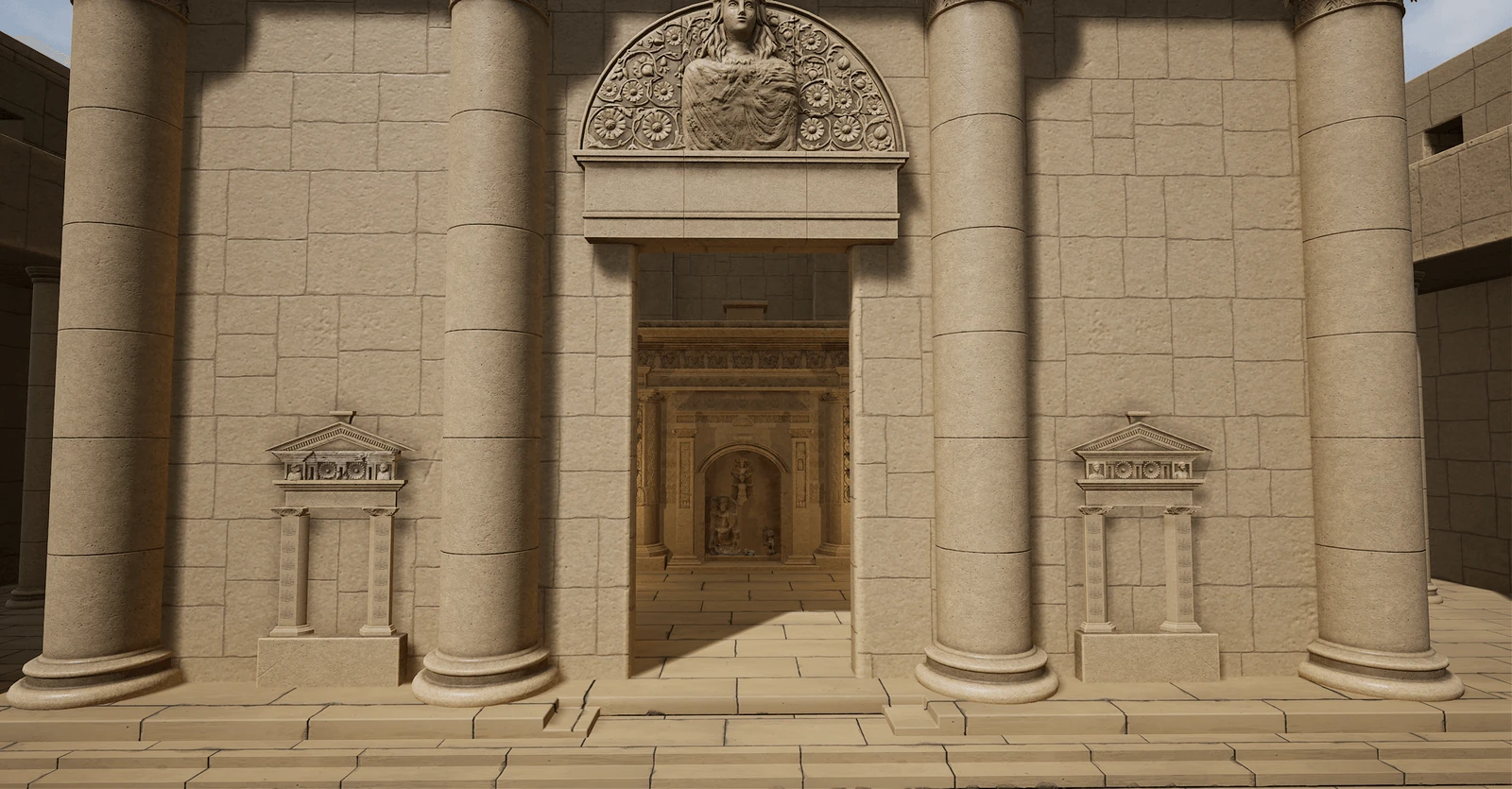 Temple entrance with reconstructed columns and carved pediment